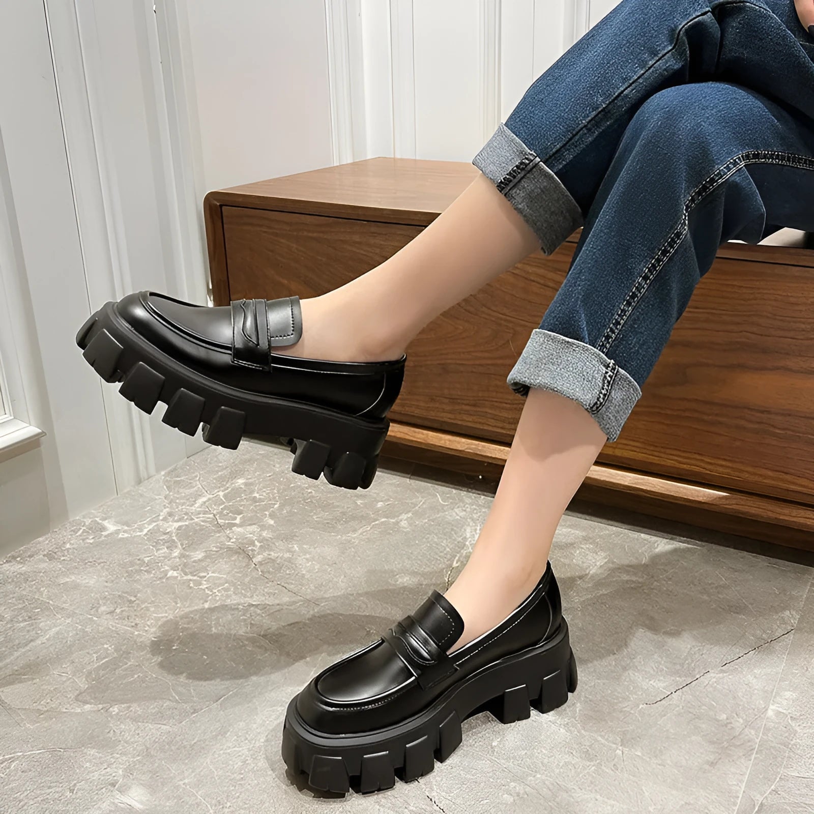 A pair of British style wide fit loafers in patent leather and matte finish options.