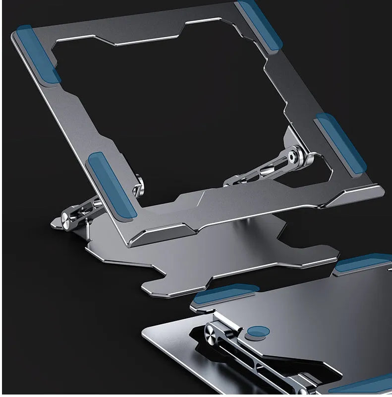Grey aluminium laptop stand folded flat next to an open laptop, showing its adjustable angle and hollow design.