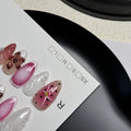 Close-up of hand-painted 3D carved nail art patches with colourful embossed candy patterns.
