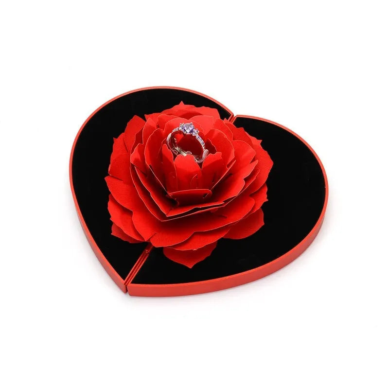 Red rotating ring box with 3D heart-shaped rose decoration for jewellery display