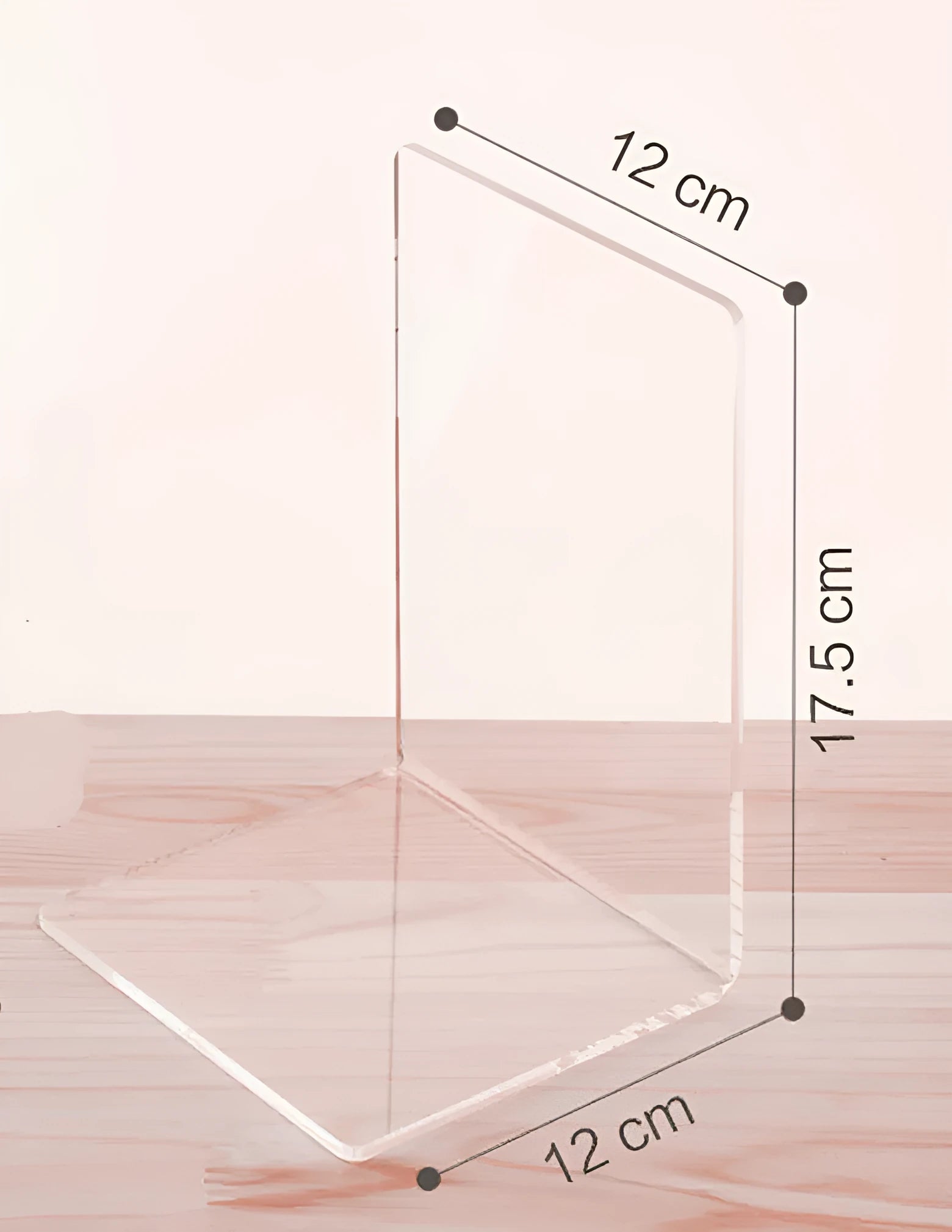 Transparent acrylic bookshelf displaying organised books on a study desk