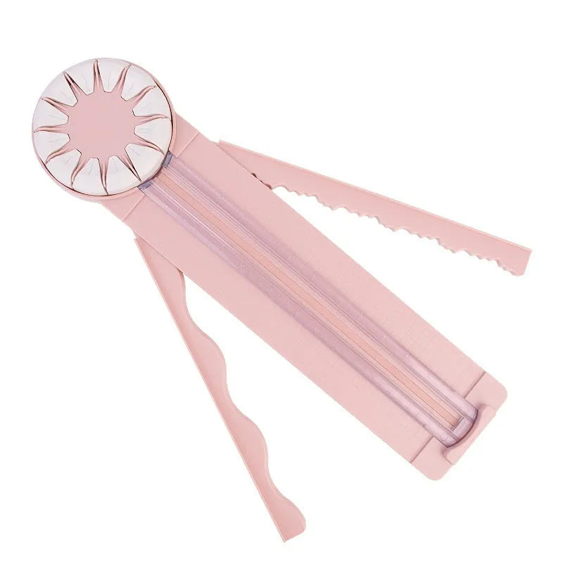 Pink and black multifunctional 12-in-1 dotted plastic paper cutter machine for crafts.