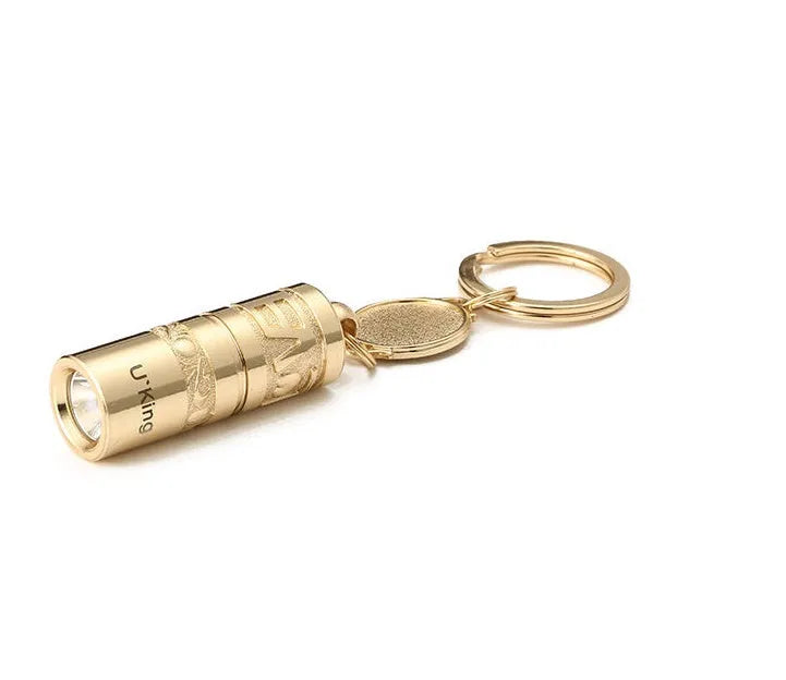 Gold-finish zinc alloy waterproof LED keychain torch with compact design for portable emergency lighting