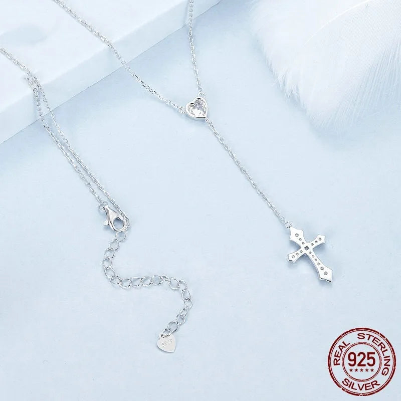Women's simple V-neck Love cross pendant necklace made from 925 silver on an O-ring chain.