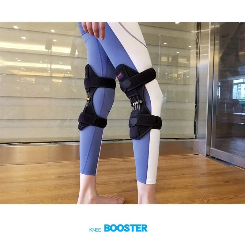 Black adjustable spring knee brace support for patella, shown on a knee with straps and venting holes.
