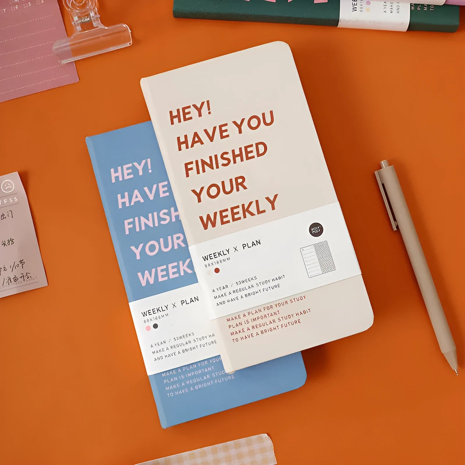 A5 weekly planner diary in blue, brown, green, and purple colours showing 100-page interior