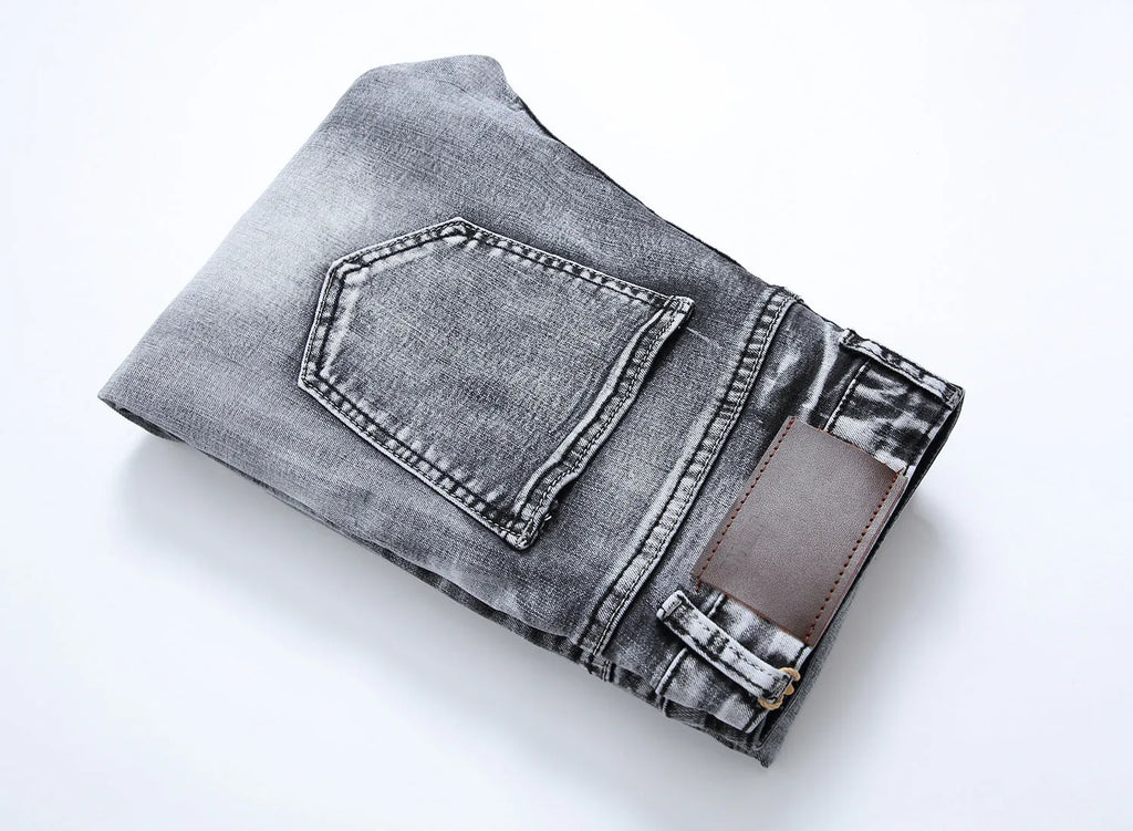 Men's grey slim fit straight leg jeans with mid waist and washed whiskers denim finish