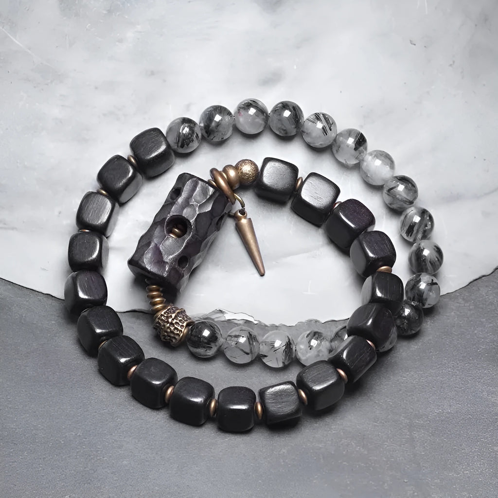 Ethnic style black hair crystal mixed handmade texture bracelet on a neutral background