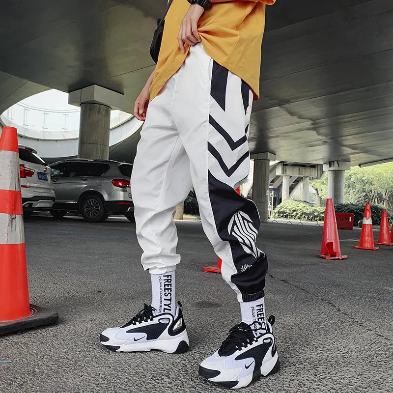 Men's gradient colour high waist nine trousers in polyester blend, available in black, blue, and white.