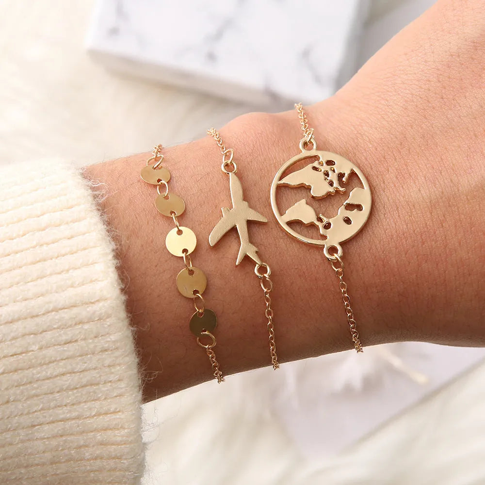 Set of three bohemian-style women's bracelets with aircraft map designs on heart-shaped alloy charms