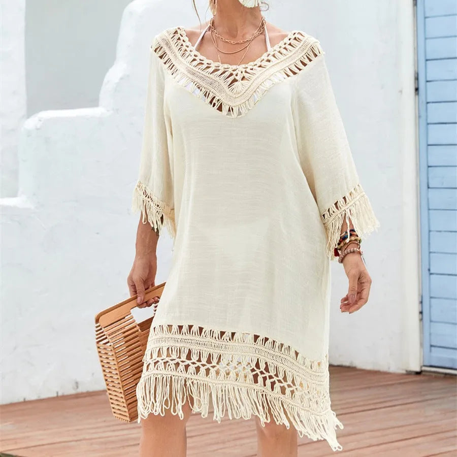 Apricot coloured crocheted patchwork dress with half sleeves and a mid-length hem.