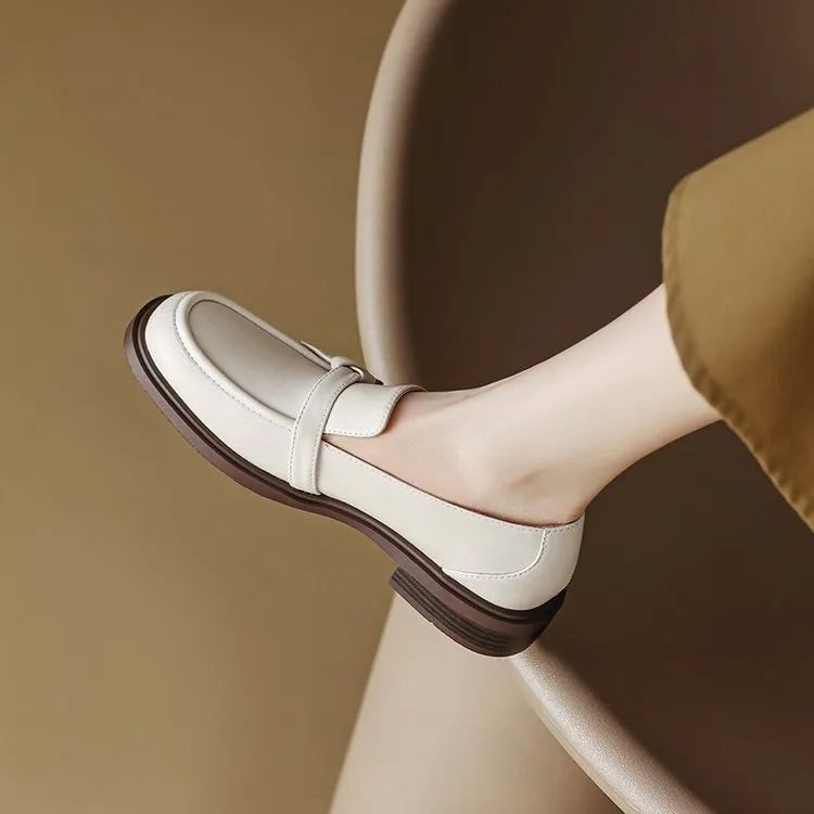 Round toe low heel slip-on women's shoes with metal and sequin details in black, side view