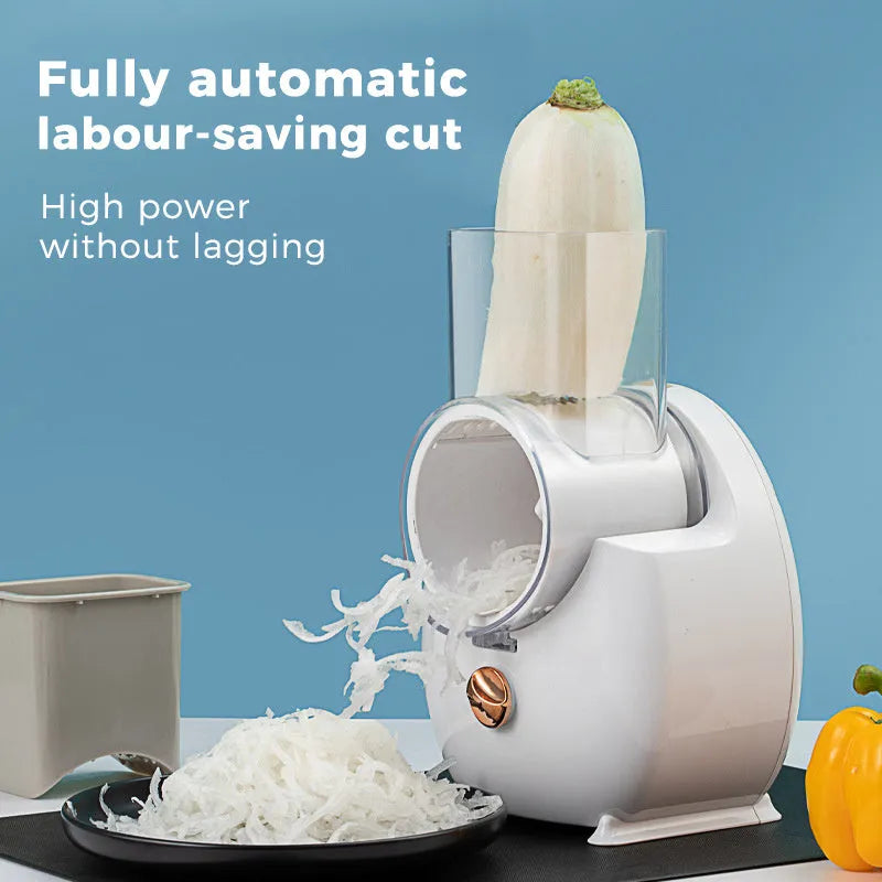White electric vegetable slicer with interchangeable blades and suction base on kitchen counter