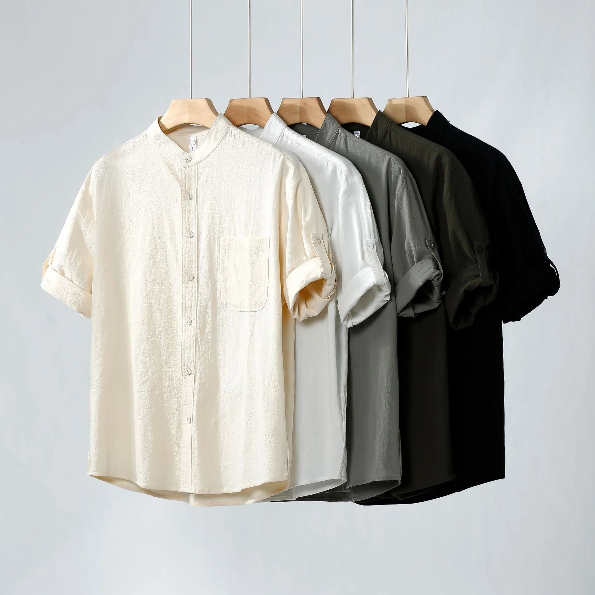 Men's loose short sleeve linen shirt in cotton blend with stand collar.