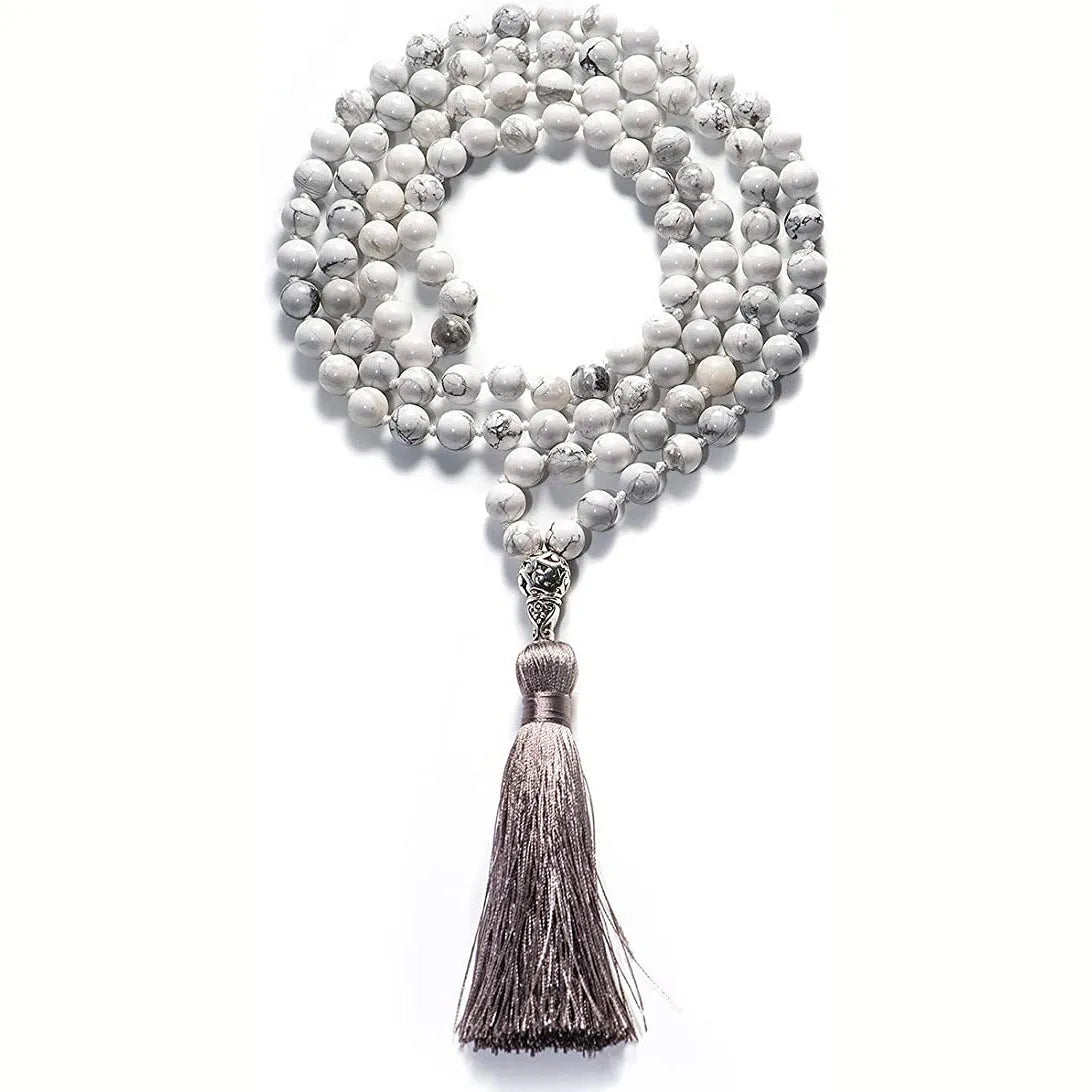 Long geometric agate and gemstone tassel necklace showing colourful beads including amethyst and lapis lazuli.