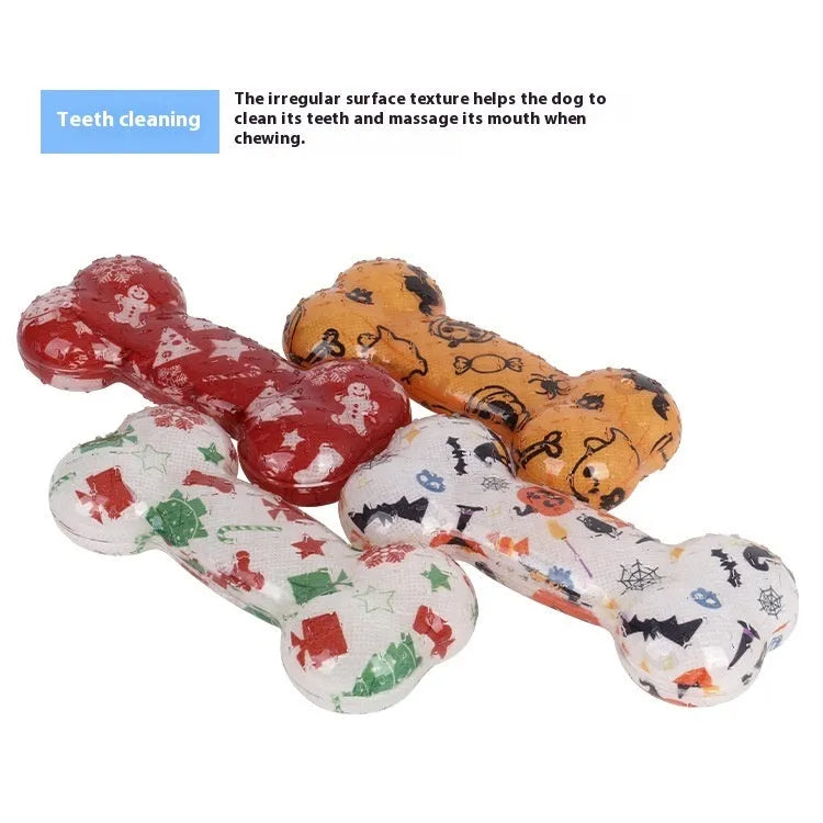 Printed bone-shaped dog toy with squeaker in seasonal Christmas red and Halloween pumpkin colours