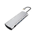 Grey aluminium alloy USB-C docking station with HDMI, VGA, USB ports, and a card reader.