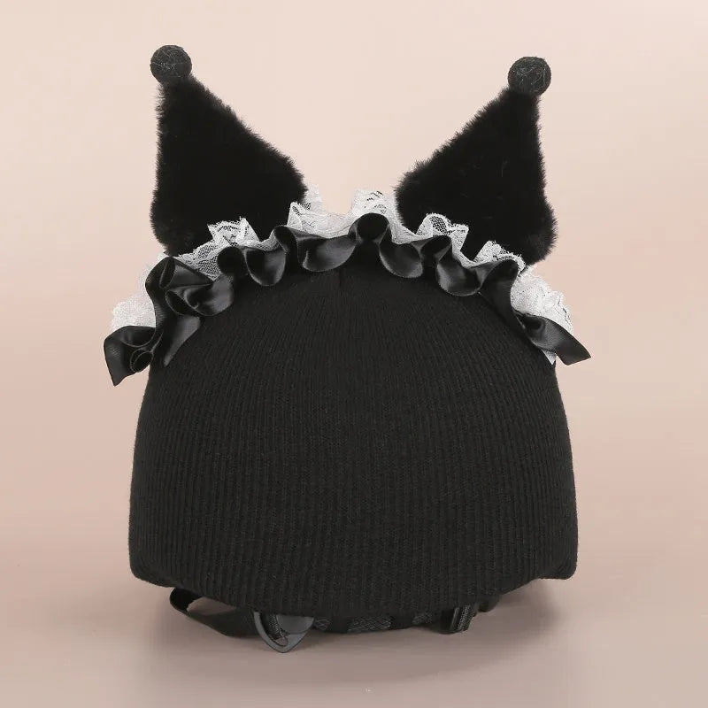 Soft plush cartoon character cover on a motorcycle helmet, showing size M and decorative ear sections.