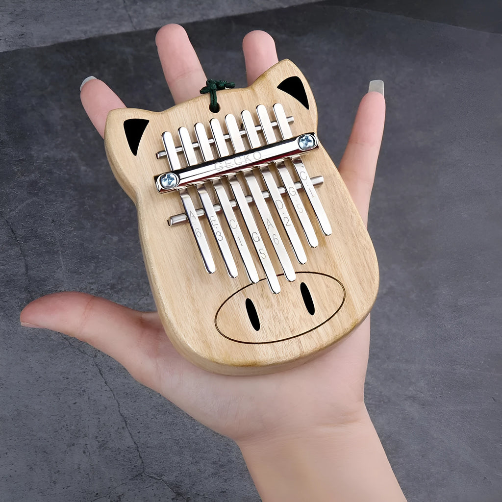 Camphorwood Mini K8 keyboard percussion instrument with five C sounds, 11.5 x 9 x 3 cm, natural wood colour.