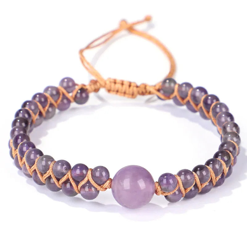 Handwoven geometric bracelet made from blue Tigereye stone beads with a slip-on closure.