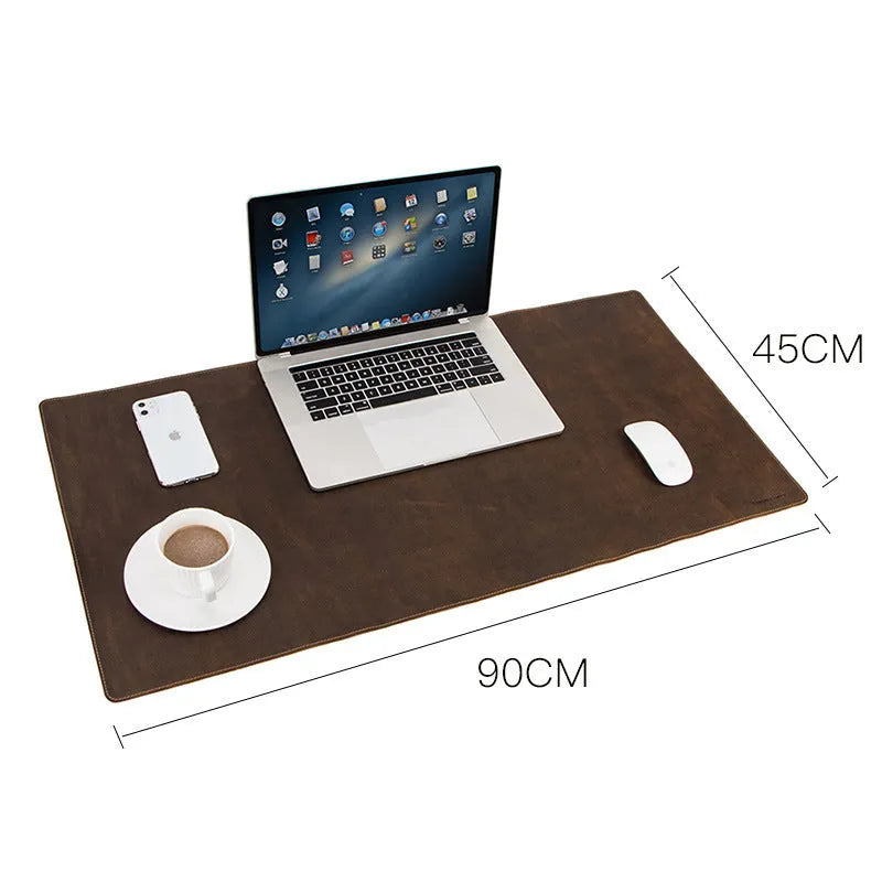 Extra large non-slip coffee mad horse skin leather desk pad, 90cm x 45cm, on a computer desk with keyboard and mouse.