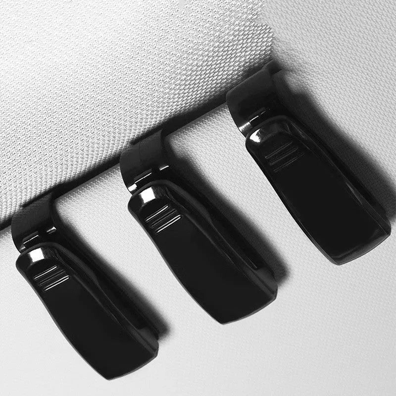 Black plastic car sunshade clip for glasses and cards measuring 6.5cm