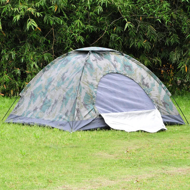Green camouflage tent with triangular skylight and fibreglass poles set up outdoors