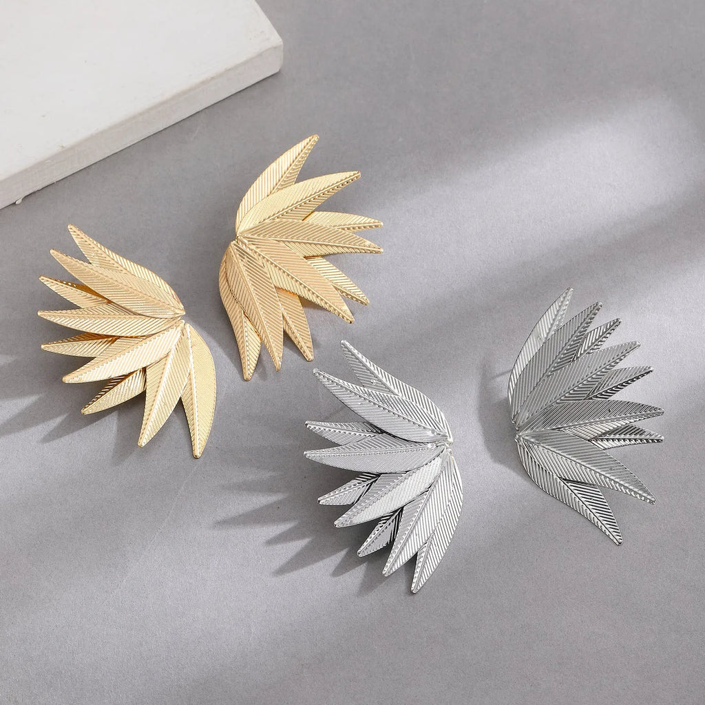 Alloy metal leaf-shaped patch earrings in white and gold colour options
