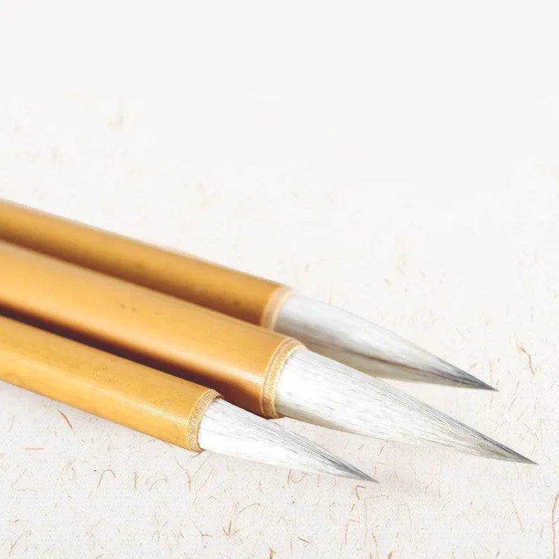Chinese painting brush set with Yang Hao Jia Jian nib and bamboo handle in three sizes laid on table