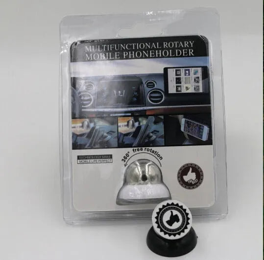 Black magnetic car phone mount on dashboard holding a smartphone with strong magnet support