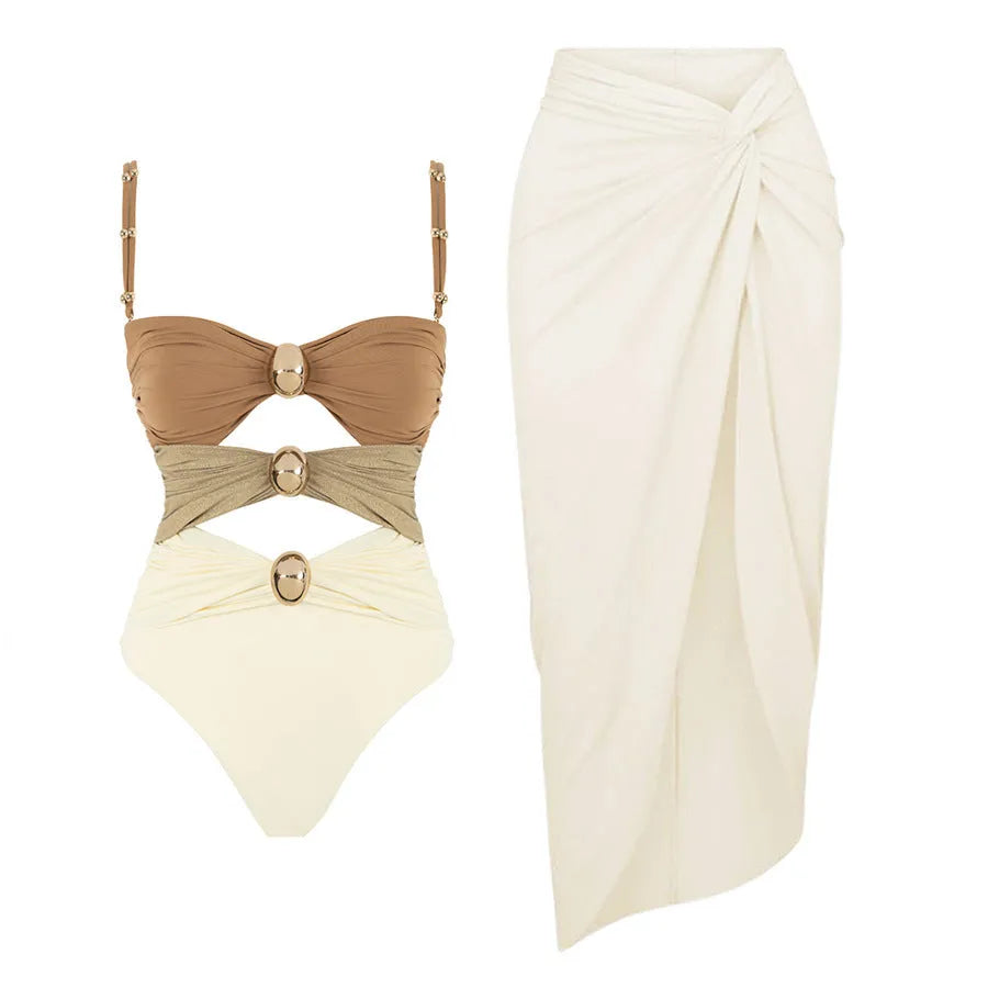 Women's one-piece swimsuit with attached skirt featuring gold buttons in black, blue, brown and pink colours