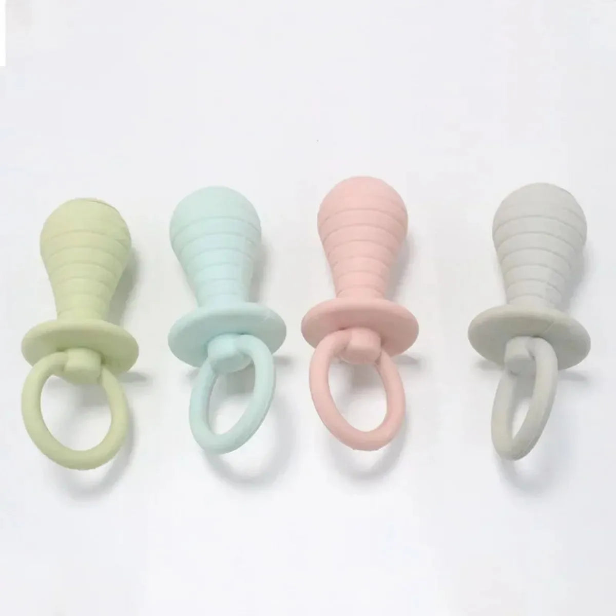 Set of four coloured TPR rubber pacifier chew toys for puppies and kittens on a white background.