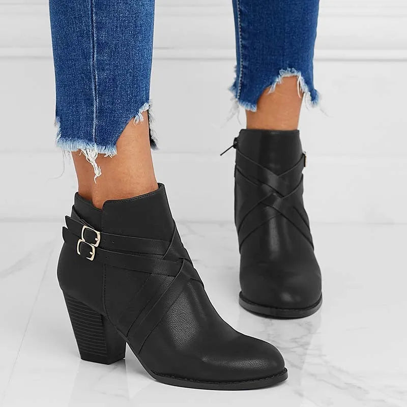 Grey women's plus size ankle boots with a 7cm chunky heel, side zipper, and belt buckle detail.
