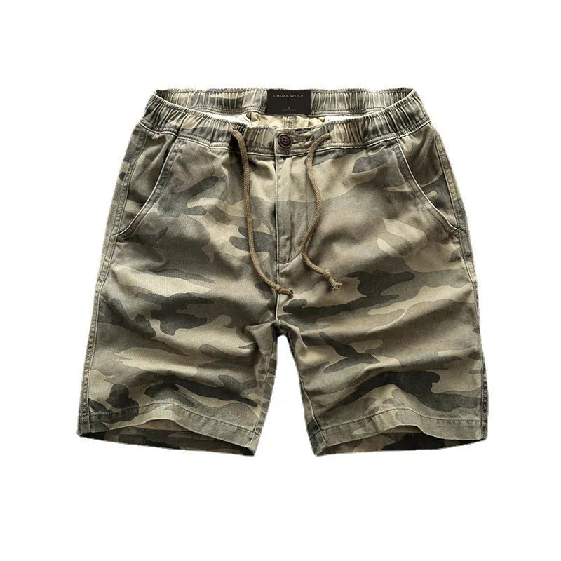 Green camouflage cotton shorts with zip fly on a mannequin, showing mid-waist fit and shorts length for casual wear.