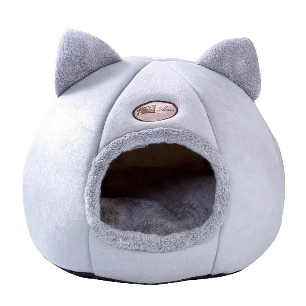 Fully enclosed plush cat winter nest sofa bed with removable cushion, shown in grey