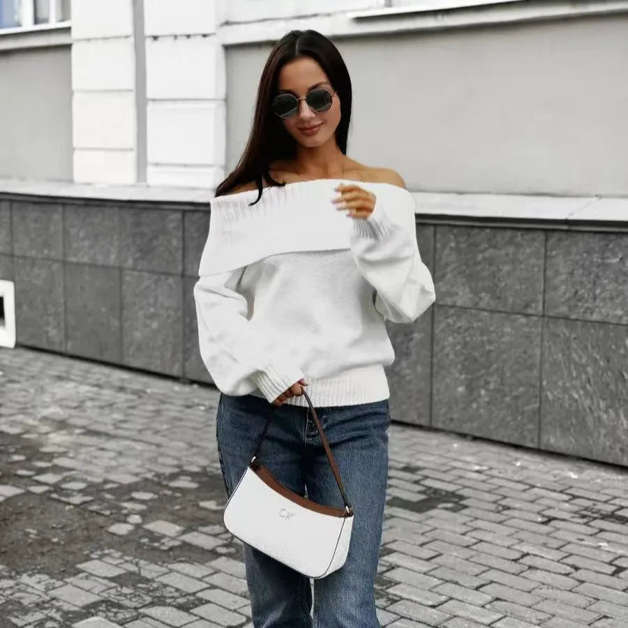Grey off-the-shoulder sweater with a 3D textured pattern and regular sleeves on a model.