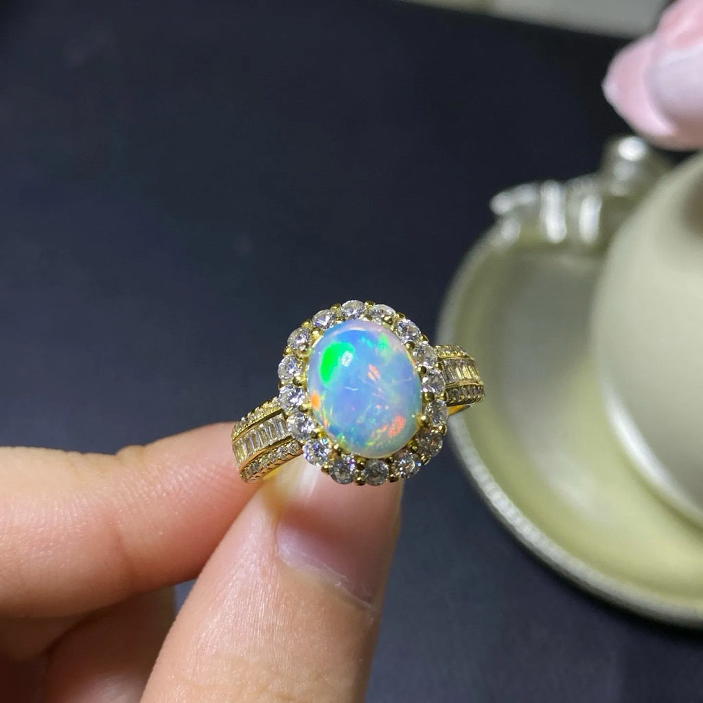 Handmade sterling silver adjustable opal ring showing rose gold, white gold, and yellow gold plated finish options.