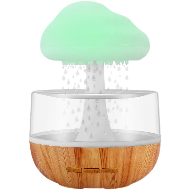 White cloud-shaped ultrasonic humidifier with colourful night light and water droplet flow.