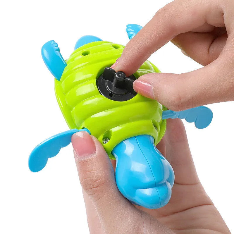 Small green plastic turtle bath toy for baby water play measuring 12cm
