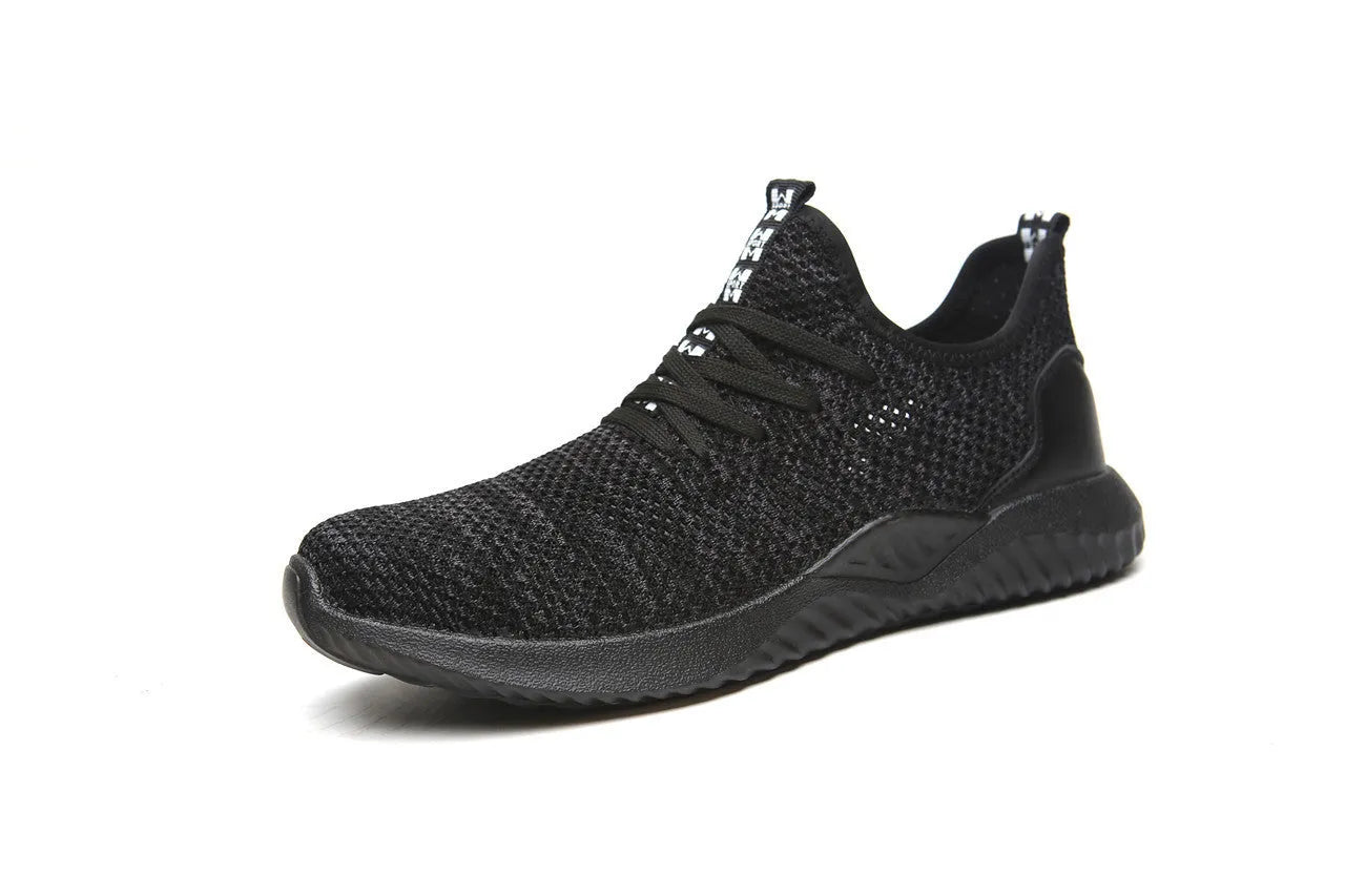 Men's black steel toe cap safety shoes with a low-cut design on a work surface.