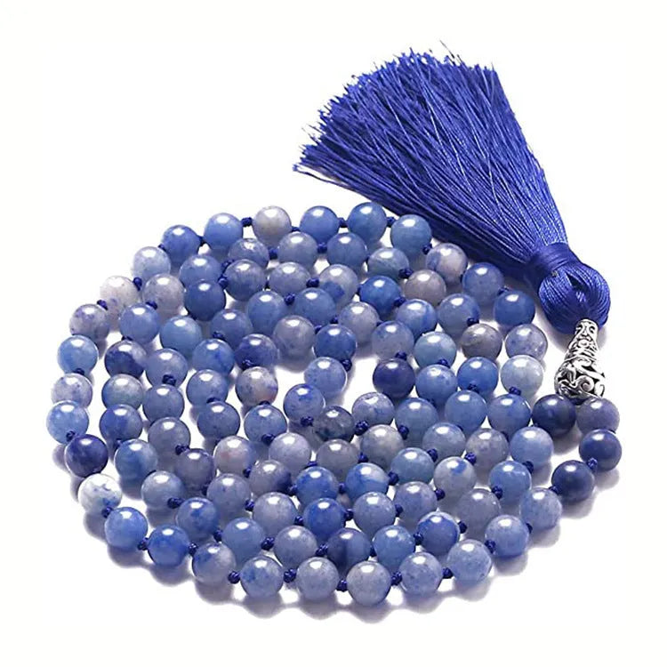 Long geometric agate and gemstone tassel necklace showing colourful beads including amethyst and lapis lazuli.