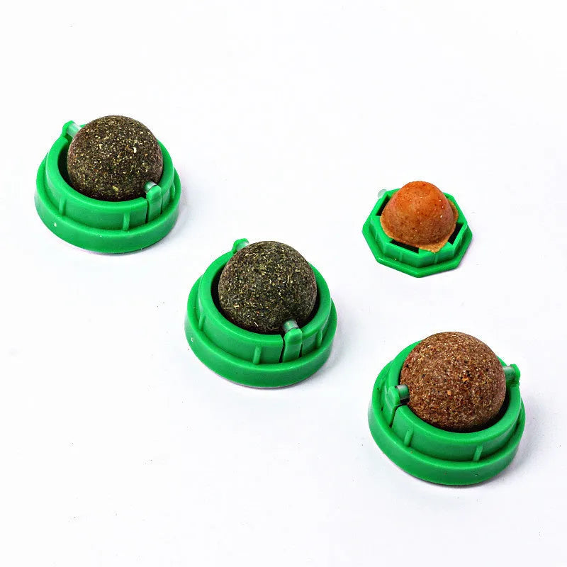 Colourful plastic catnip ball chew toy for dental care on a white background.