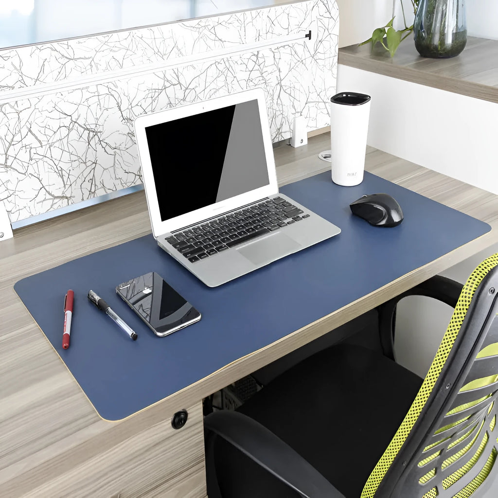 Oversized double-sided PU mouse table mat in sapphire blue and yellow on a desk