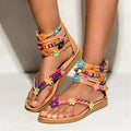 Ethnic style beaded petal sandals in artificial PU leather with floral decoration and round toe.