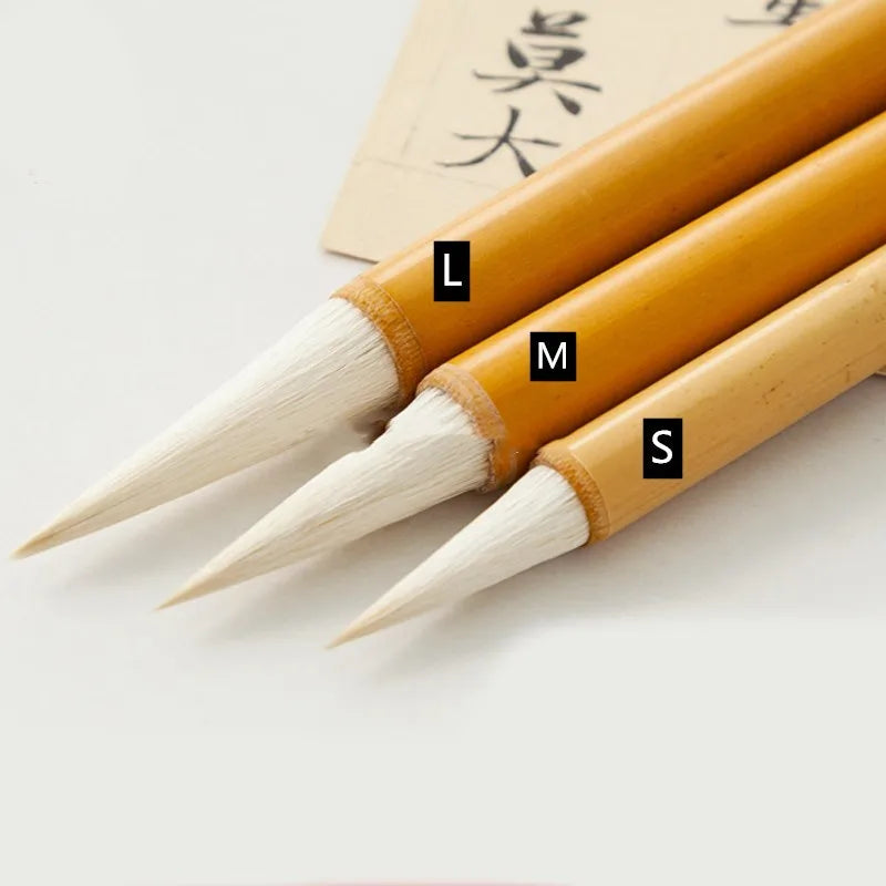 Chinese painting brush set with Yang Hao Jia Jian nib and bamboo handle in three sizes laid on table