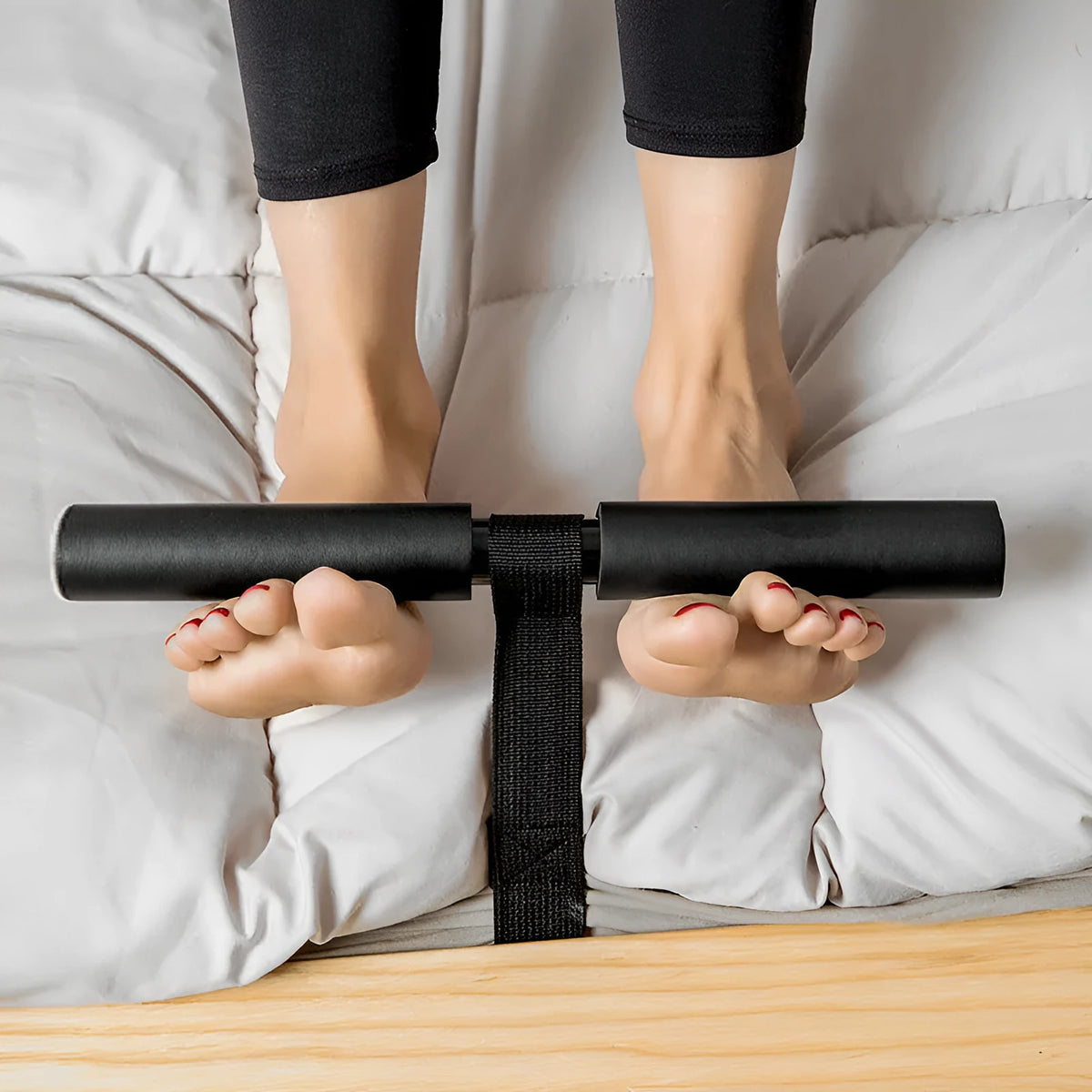 Black abdominal fitness device made from steel foam and PVC tube, 3.1 by 32 by 21.5 centimetres on a flat surface