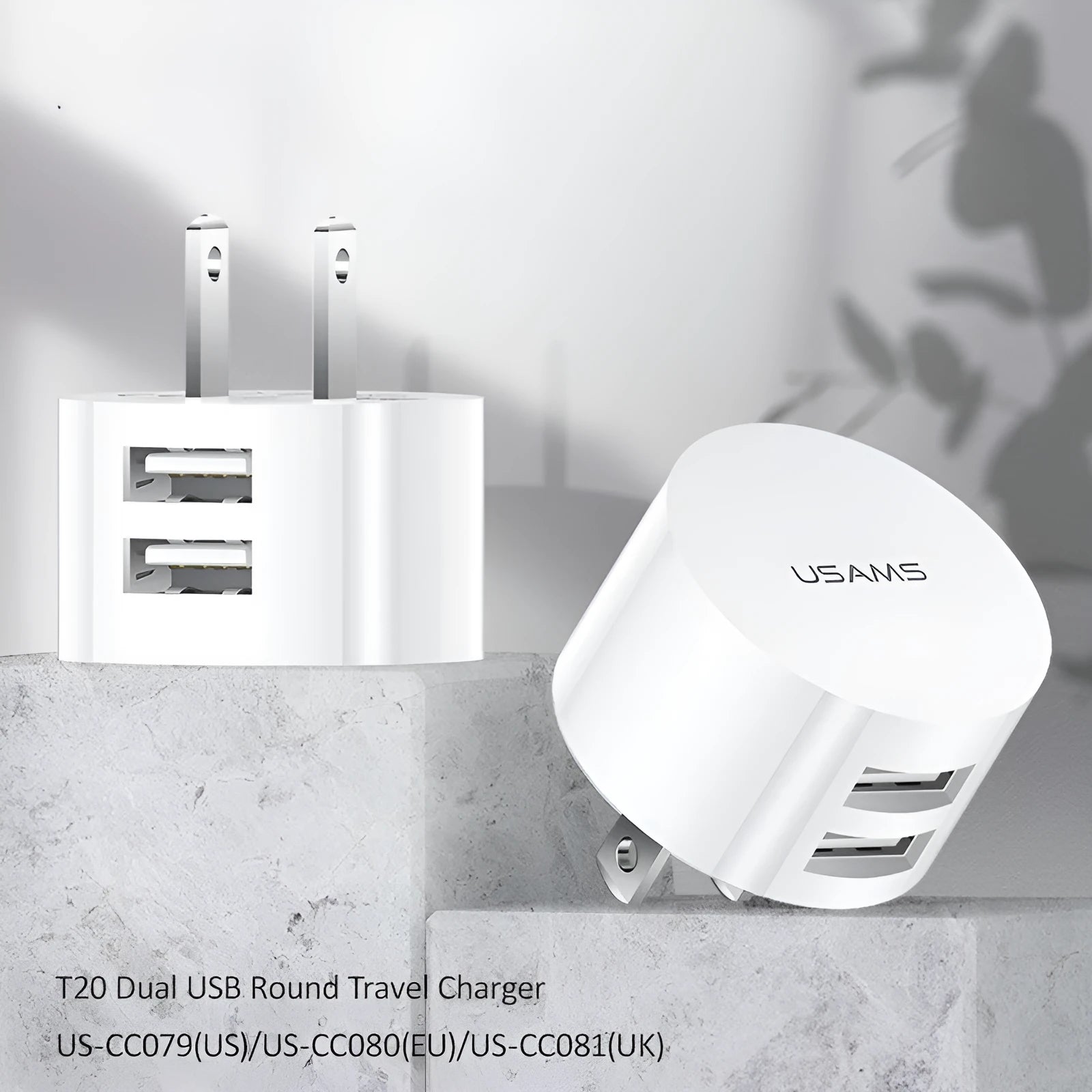 White portable universal dual USB phone charger with US, EU, and UK plug types.