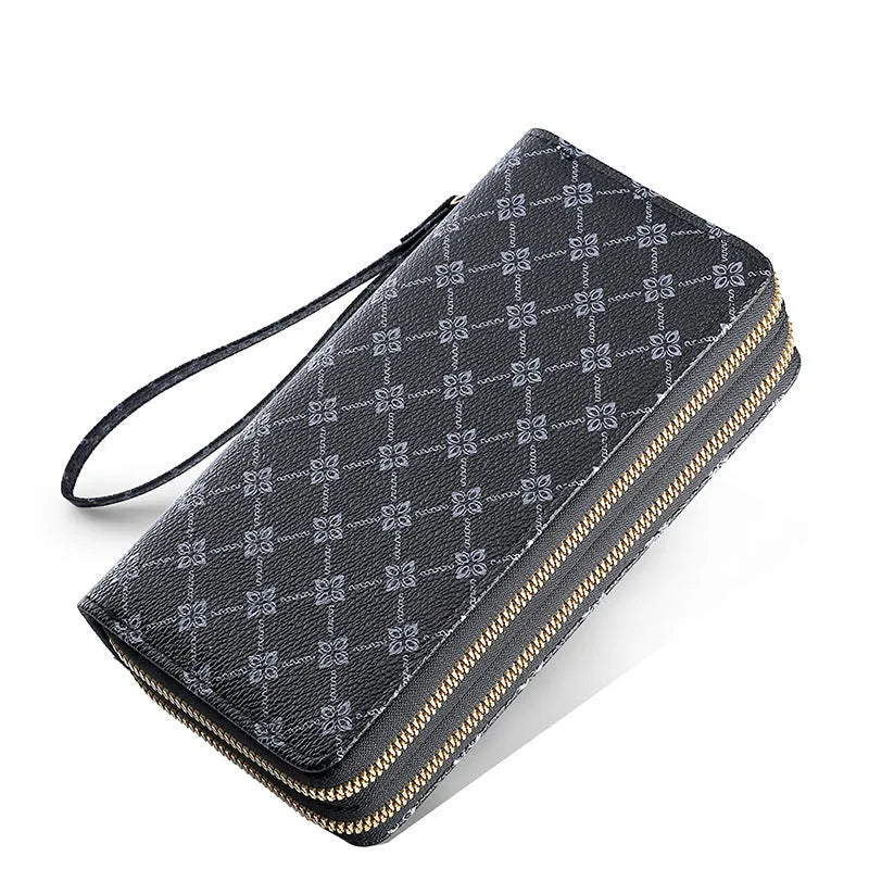 Black retro print long wallet clutch bag with zipper, holding a mobile phone and cards.