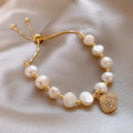 Baroque freshwater pearl zircon bracelet with geometric inlaid design and magnetic clasp on a white background