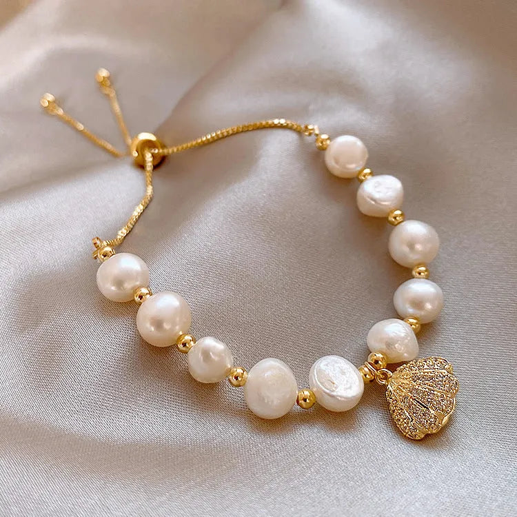Baroque freshwater pearl zircon bracelet with geometric inlaid design and magnetic clasp on a white background